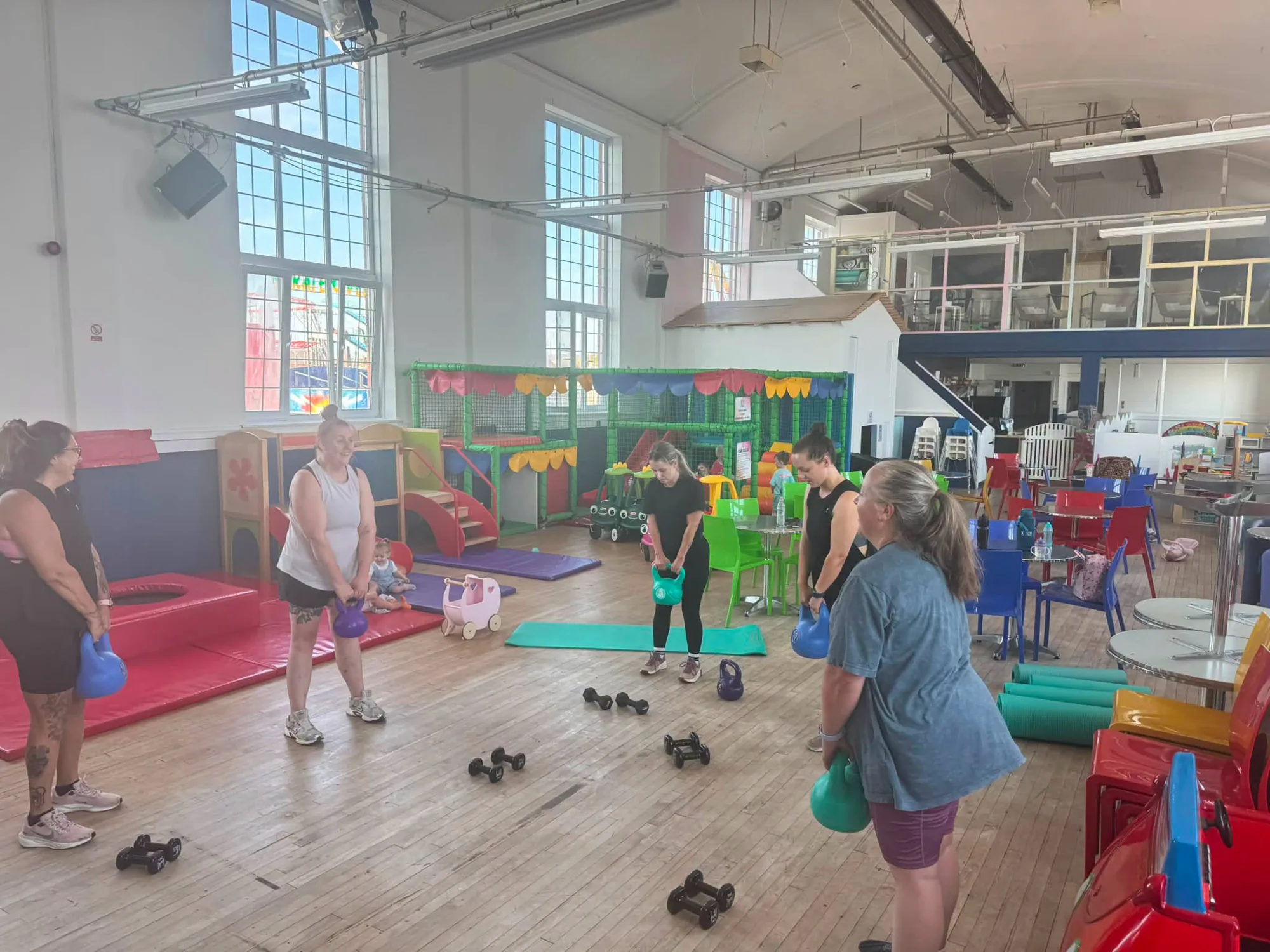The hall at Little Legends with the café and both play areas