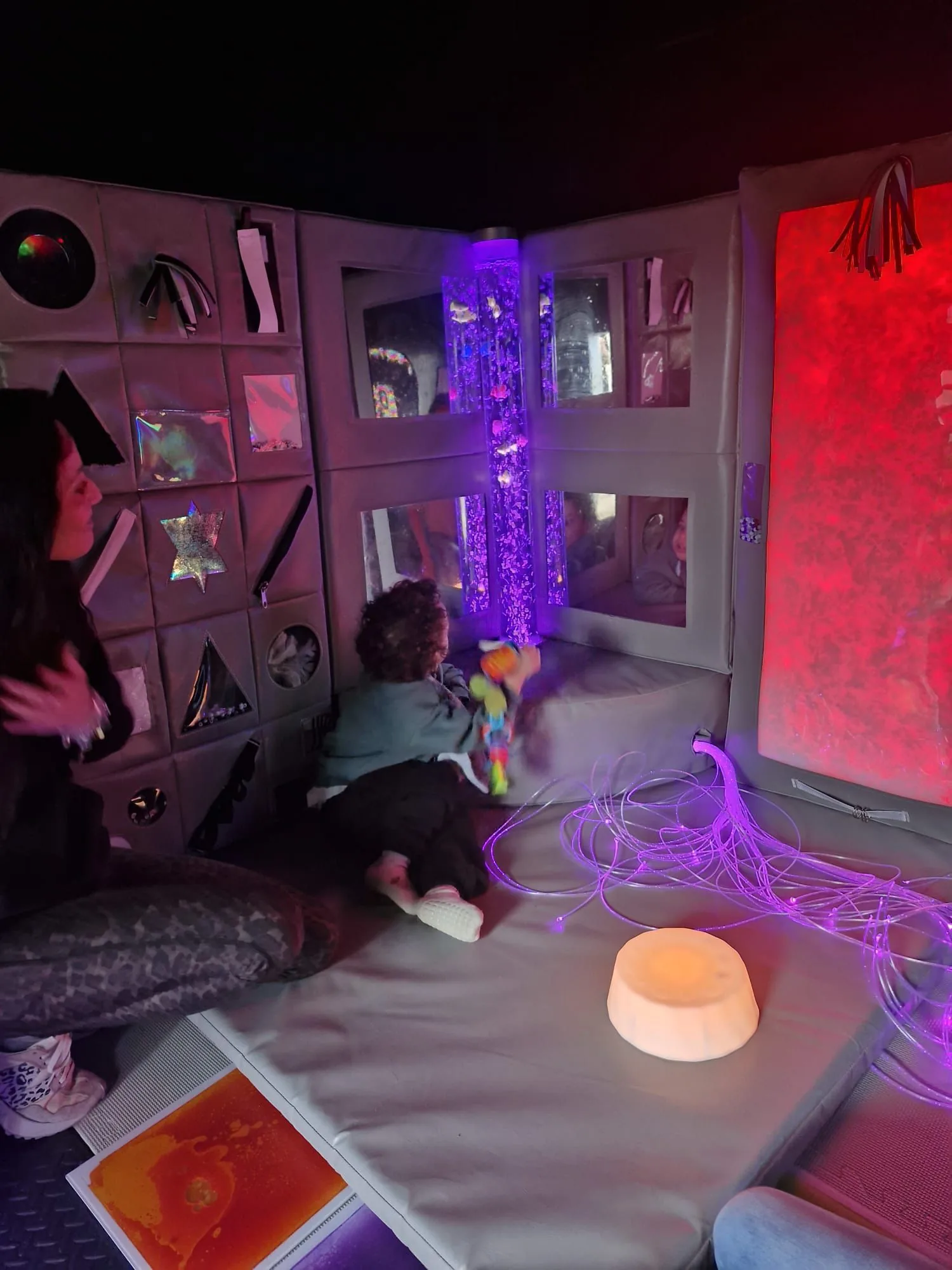 A child relaxing in the sensory room